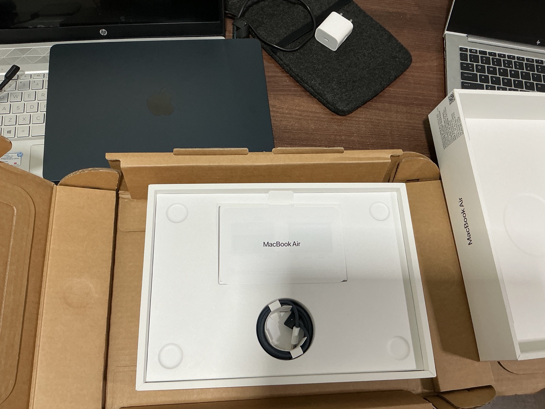 The MacBook Air box contents, with the charging cable tucked into its place