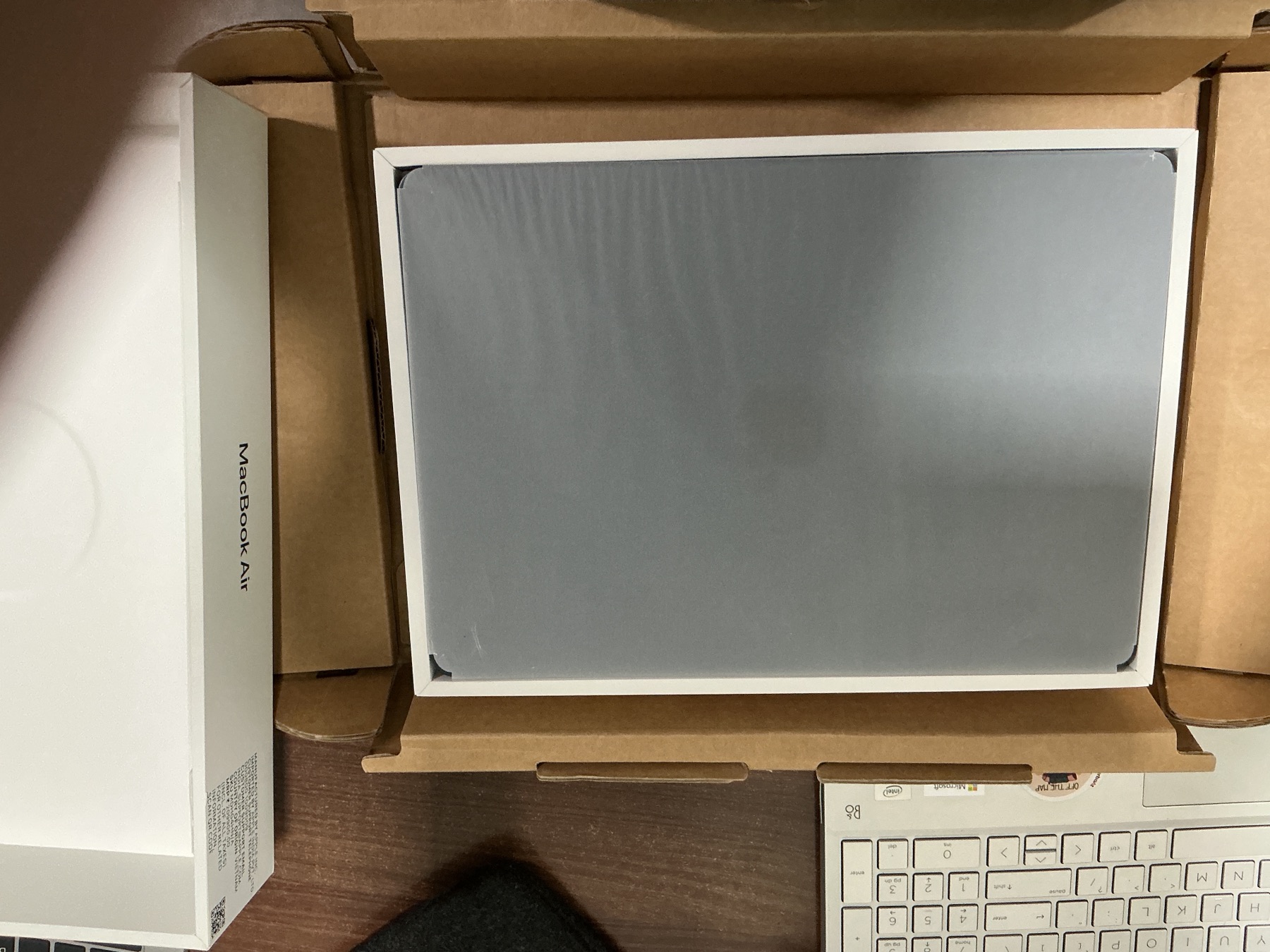 The MacBook Air revealed inside its open box