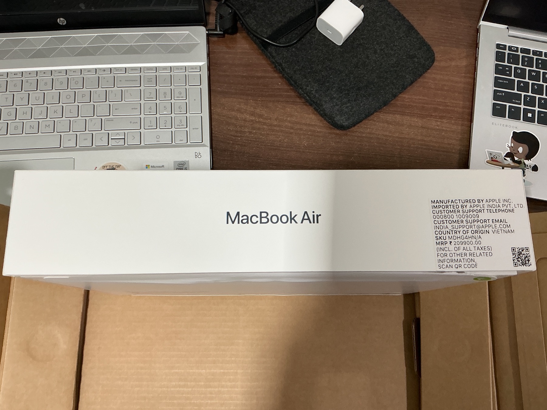 The shipping carton opened to reveal the MacBook box